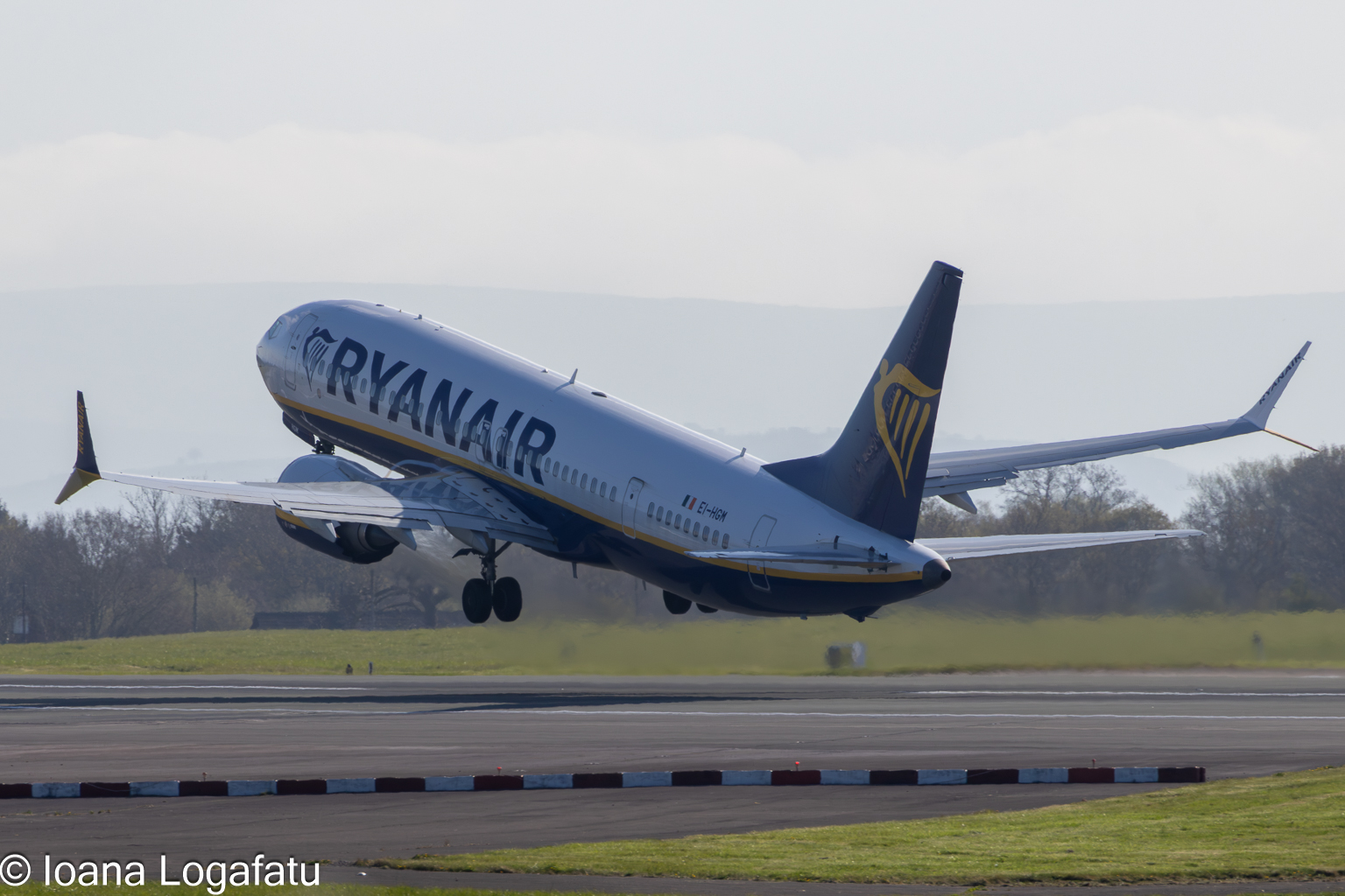 Airplane takes off against a clear blue sky